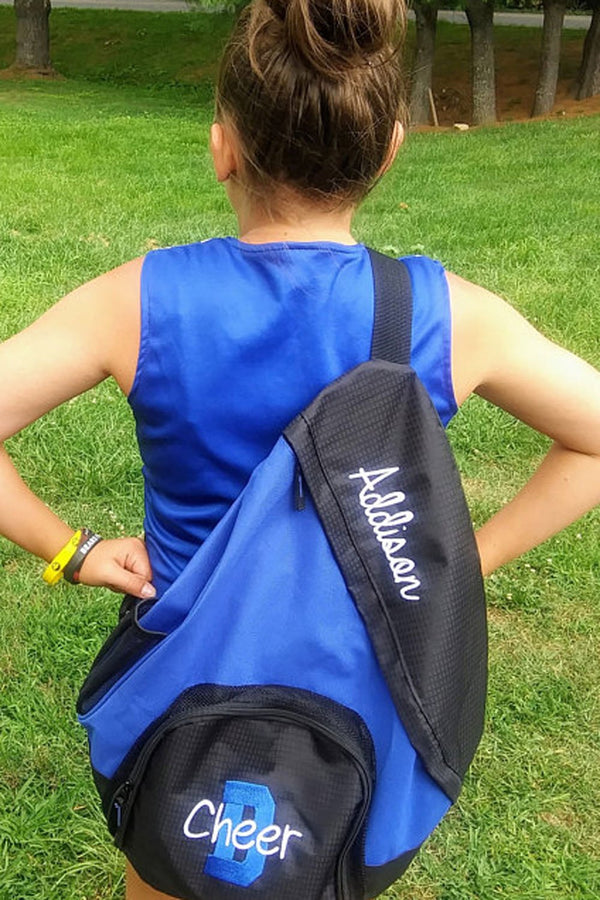 cheerleader with blue and black personalized sling backpack